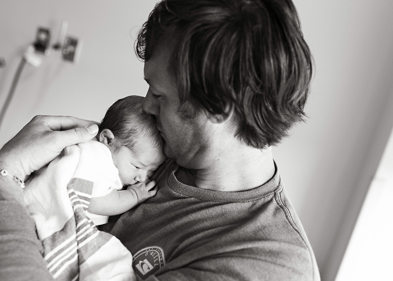 daddy holds his newborn girl at Tulane Lakeside Hospital