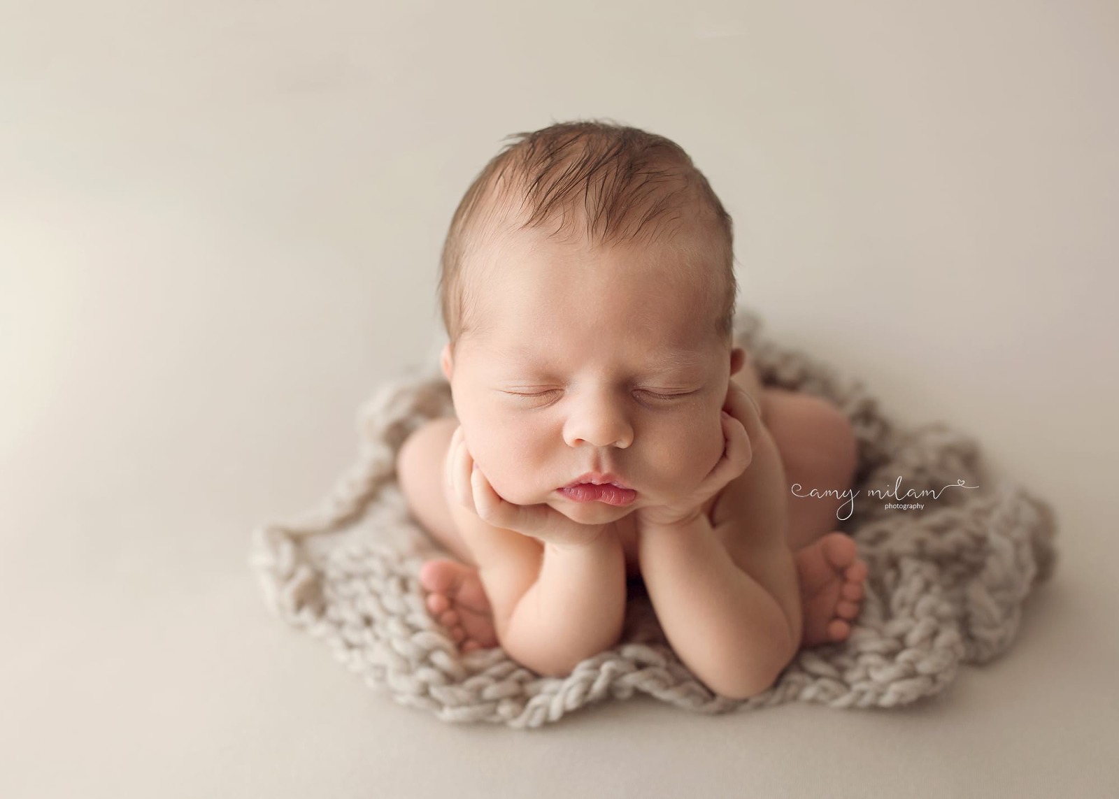 Froggie pose of newborn boy in Metairie