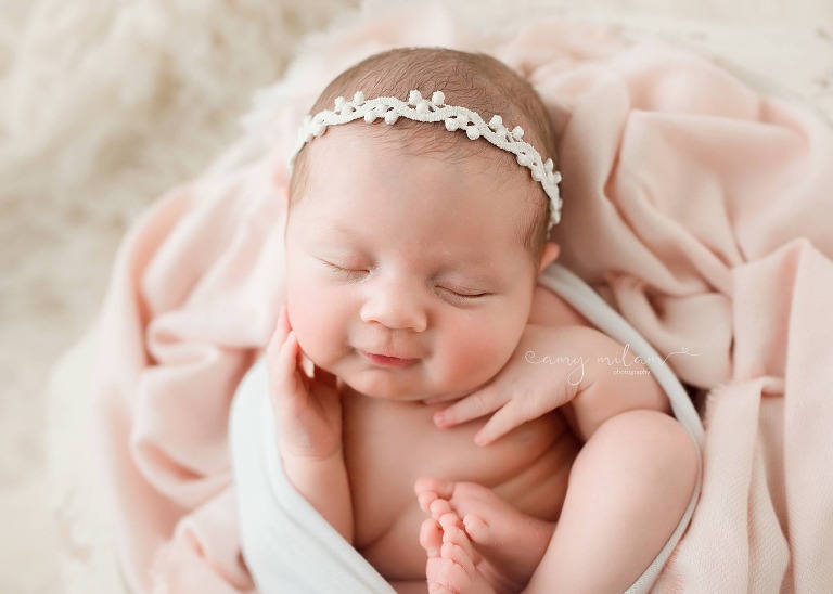 newborn girl in white bowl